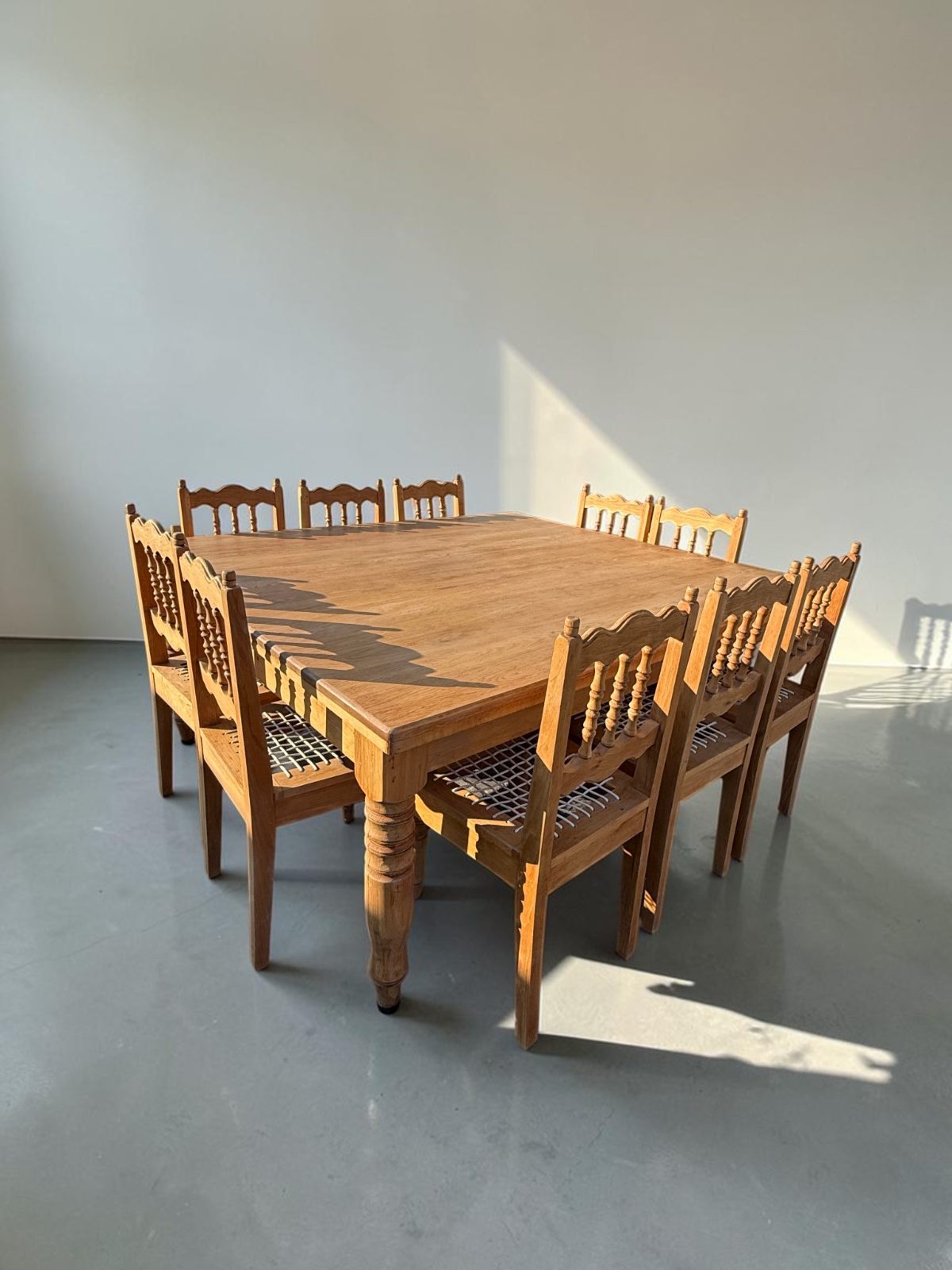 10 seater solid Oak Dining table and 10 Oak Riempie chairs